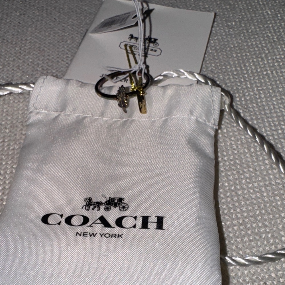 NWT, Coach vintage feather pinky ring in dark metal .